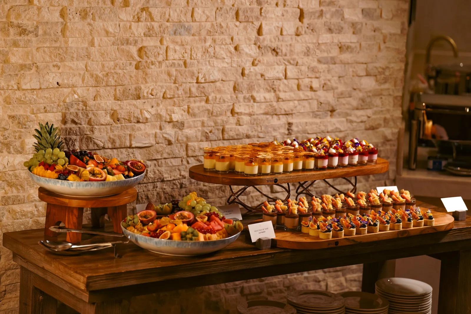 A complete Mirsam wedding table, arranged with fruit and individual desserts